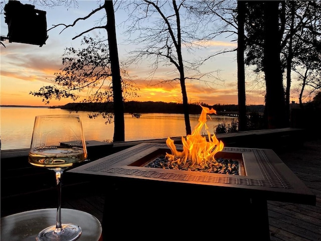 dock area featuring a water view and an outdoor fire pit