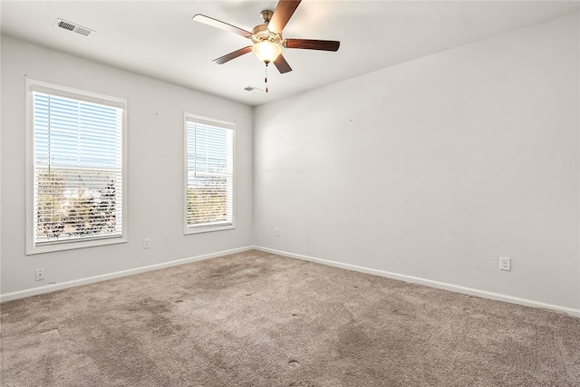 empty room with carpet floors and ceiling fan