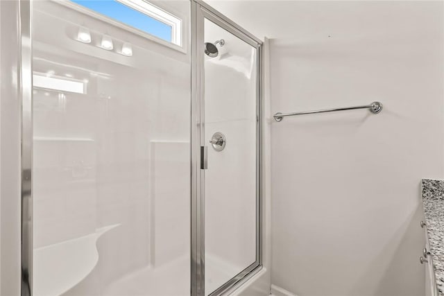 bathroom featuring walk in shower