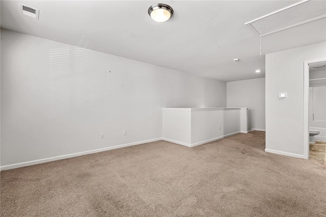 spare room with light carpet