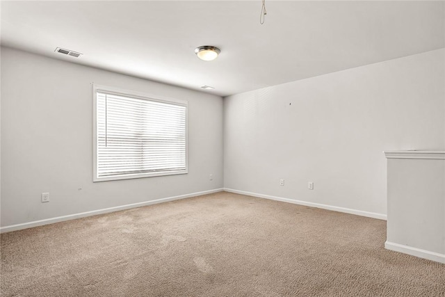 spare room with carpet floors