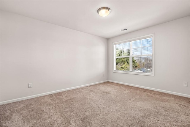 spare room featuring carpet flooring