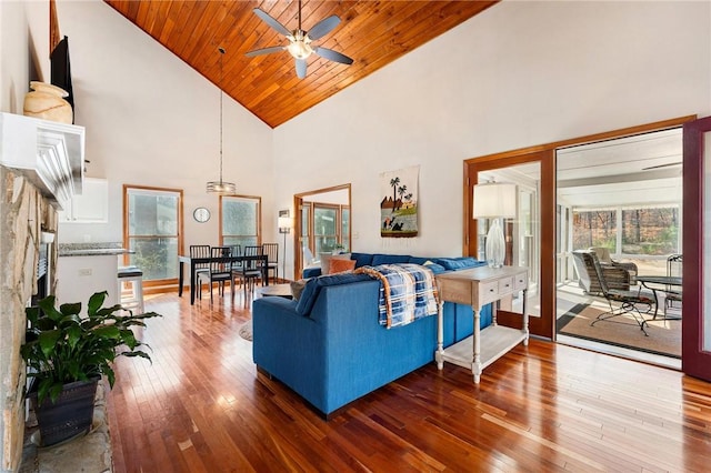 living room with high vaulted ceiling, hardwood / wood-style flooring, wooden ceiling, and ceiling fan