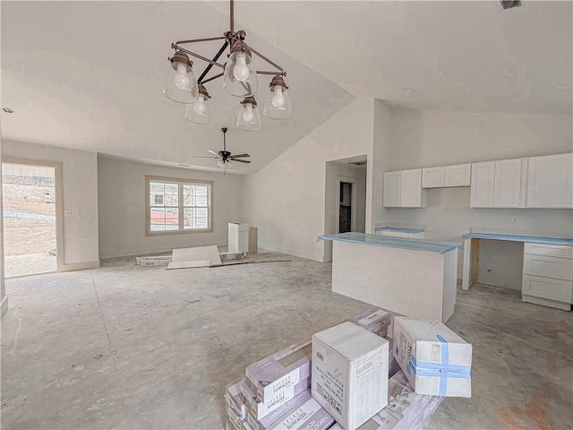 unfurnished living room featuring high vaulted ceiling and ceiling fan