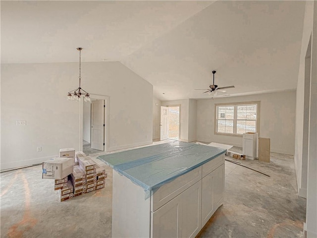 kitchen with lofted ceiling, white cabinetry, a kitchen island, pendant lighting, and ceiling fan with notable chandelier