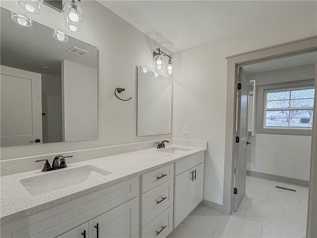 bathroom featuring vanity and tile patterned flooring