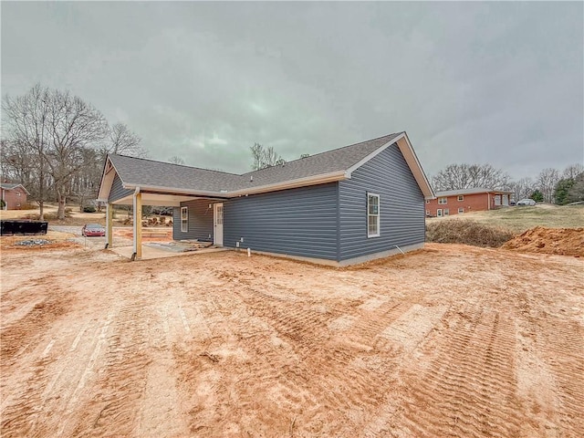 view of side of property featuring a patio