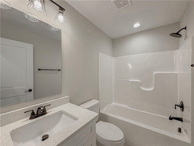 full bathroom featuring shower / bathtub combination, vanity, and toilet