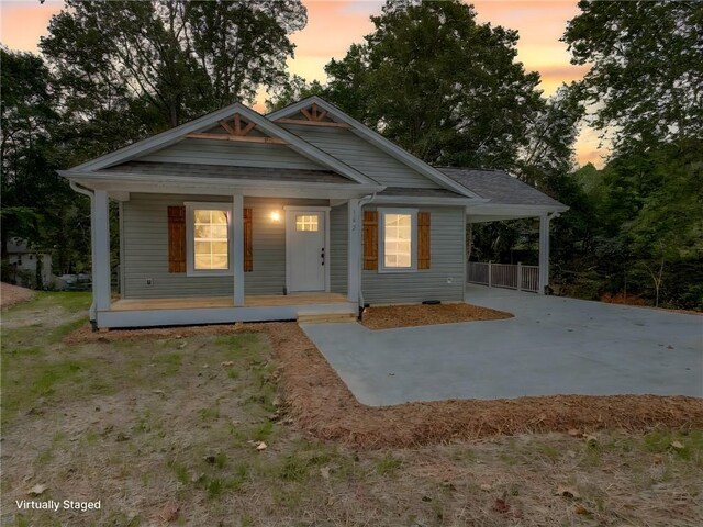 view of front facade featuring a carport and covered porch