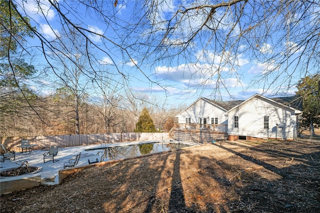 view of yard featuring a swimming pool and a patio