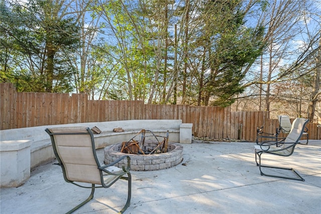 view of patio / terrace with an outdoor fire pit