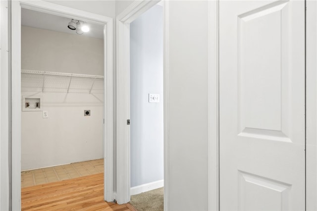 laundry area featuring hookup for a washing machine, laundry area, electric dryer hookup, and wood finished floors