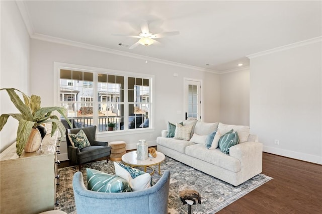 living room featuring ornamental molding, dark wood-type flooring, and ceiling fan