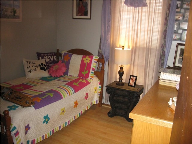 bedroom featuring wood finished floors