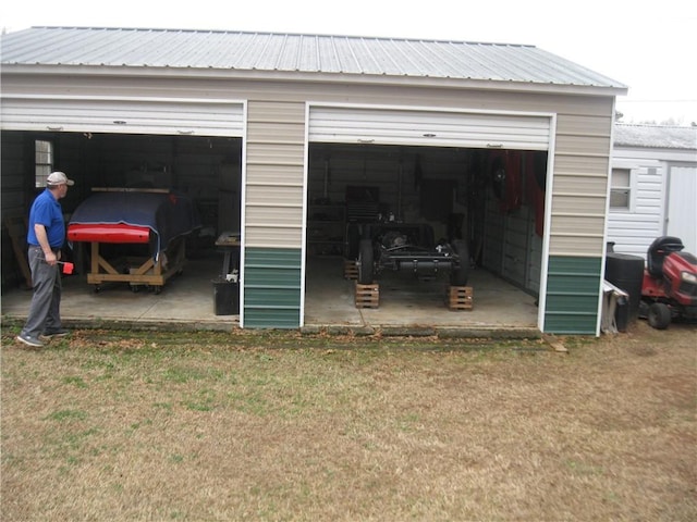 garage with a yard