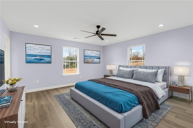 bedroom featuring hardwood / wood-style flooring and ceiling fan