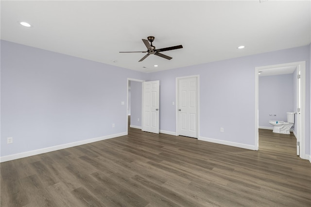 unfurnished bedroom featuring dark wood-type flooring and ceiling fan