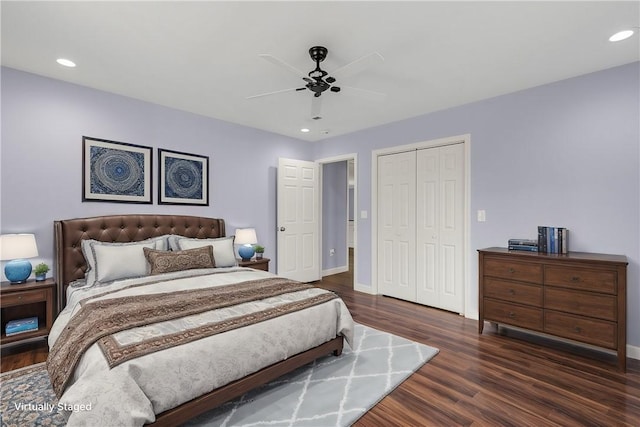 bedroom featuring dark hardwood / wood-style flooring, a closet, and ceiling fan