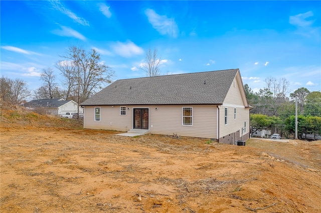 back of property featuring french doors and central air condition unit