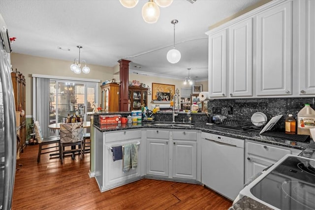 kitchen featuring white cabinetry, kitchen peninsula, and dishwasher