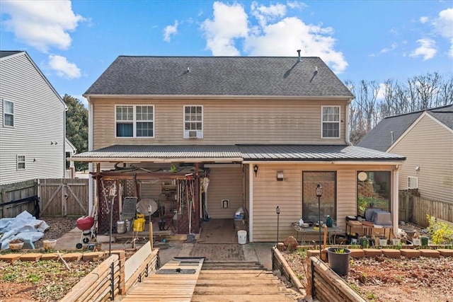 rear view of property featuring a patio area