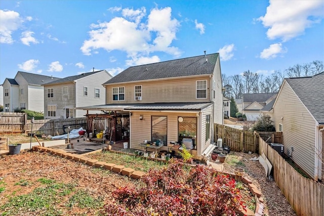 back of house with a patio area