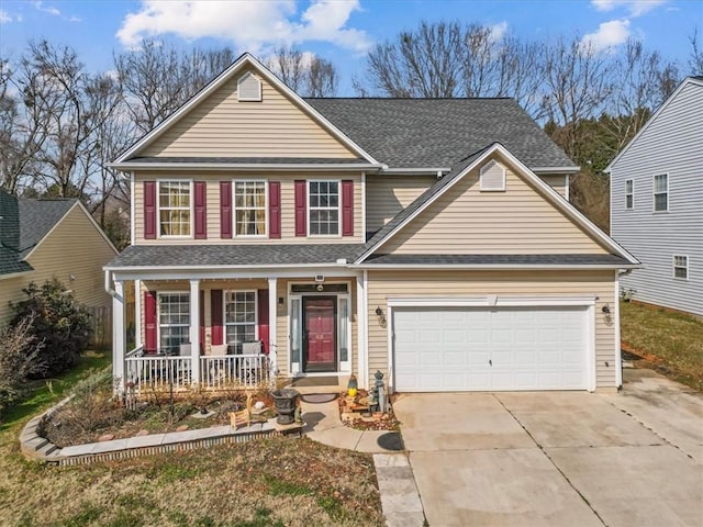 view of front of property featuring a garage and a porch