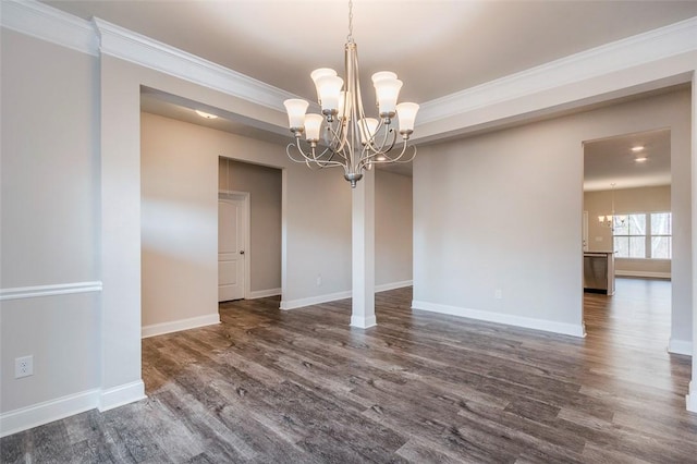 unfurnished dining area with crown molding, dark hardwood / wood-style floors, and a chandelier