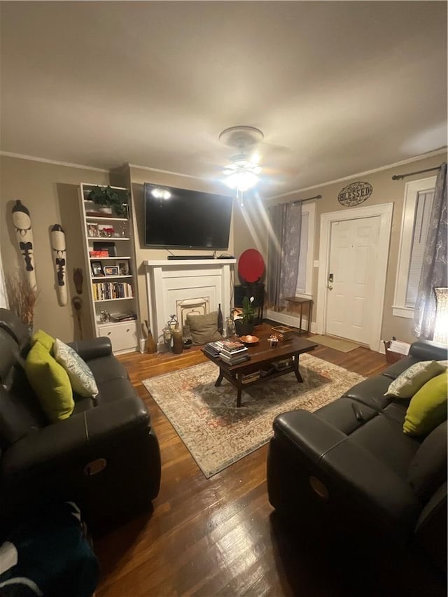 living room featuring crown molding and dark hardwood / wood-style floors