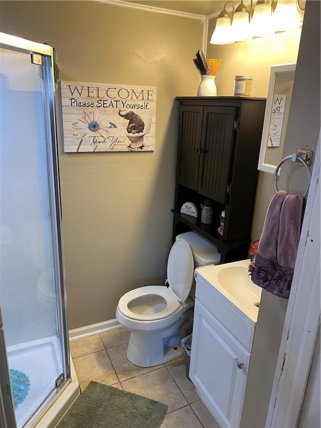 bathroom featuring vanity, an enclosed shower, tile patterned flooring, and toilet