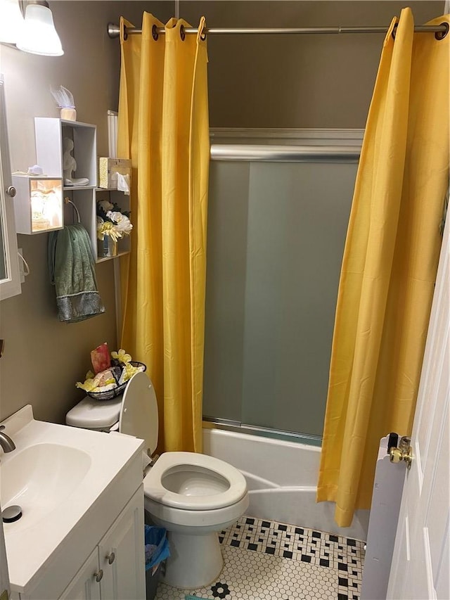 full bathroom featuring vanity, shower / bathtub combination with curtain, tile patterned floors, and toilet