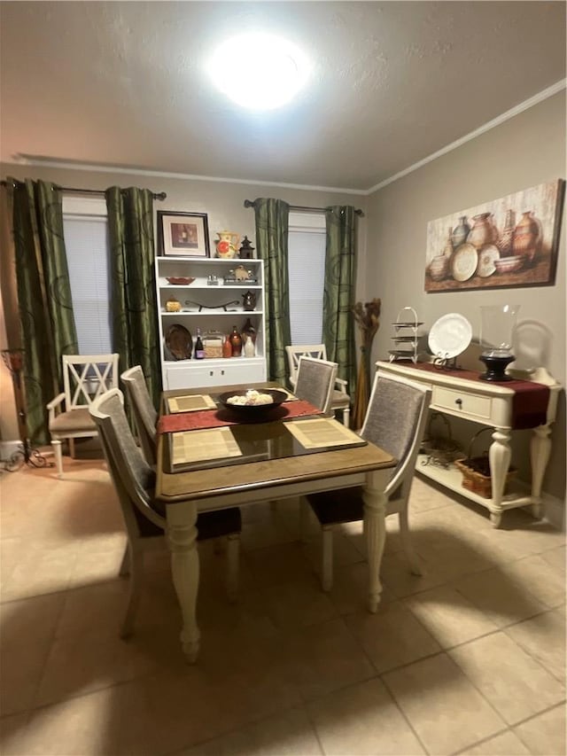 dining space featuring ornamental molding