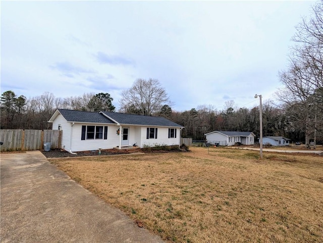 ranch-style home with a front lawn