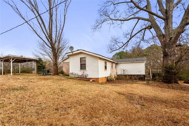 view of property exterior with a yard