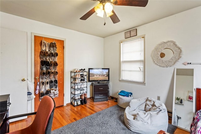 office featuring wood-type flooring and ceiling fan