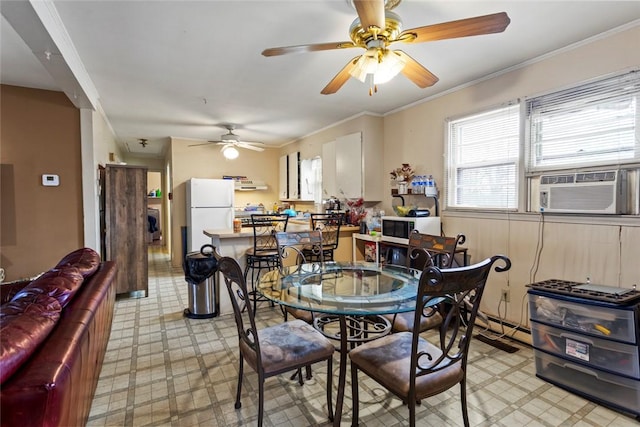 dining space featuring cooling unit and crown molding