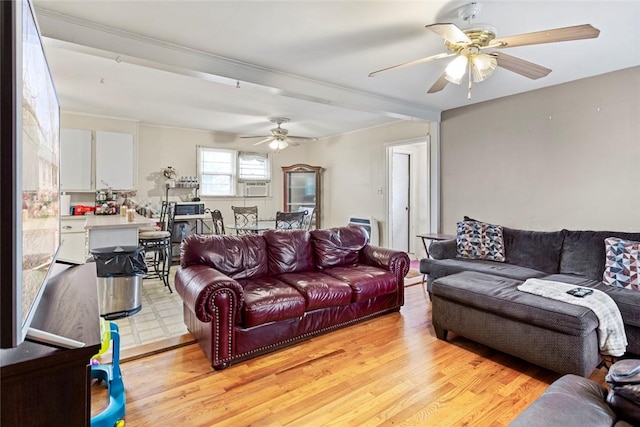 living room with light hardwood / wood-style floors and ceiling fan