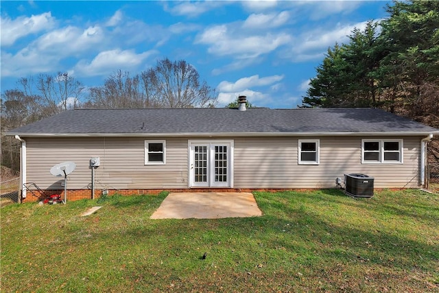 rear view of house with a yard, a patio, and central air condition unit