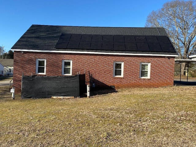 view of home's exterior with a yard