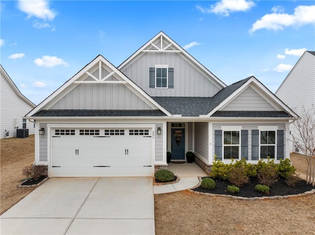 craftsman-style house featuring a garage and cooling unit