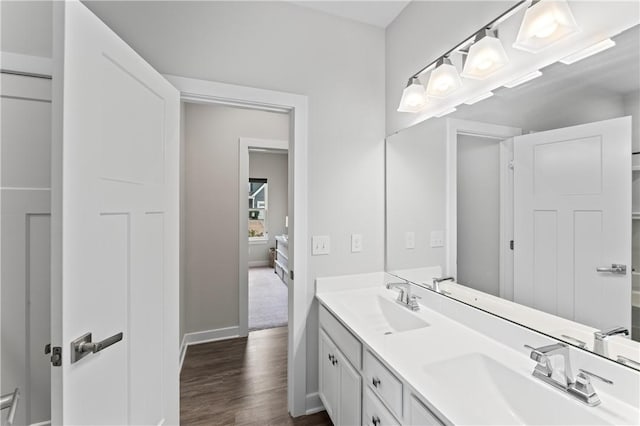 bathroom featuring hardwood / wood-style flooring and vanity