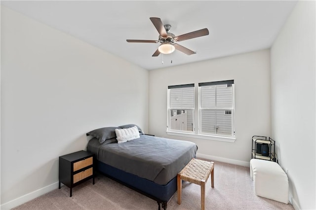 bedroom with ceiling fan and carpet floors