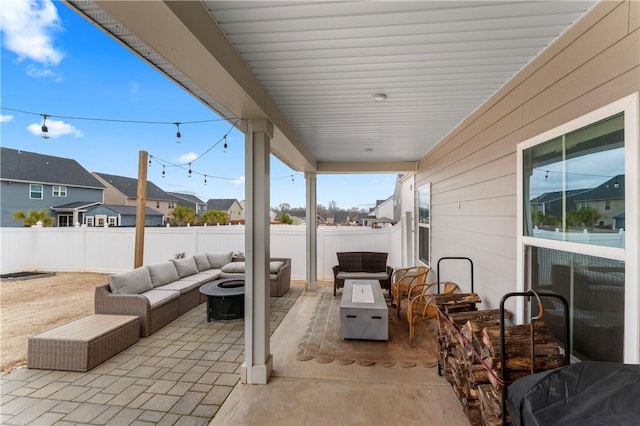 view of patio / terrace featuring an outdoor living space with a fire pit