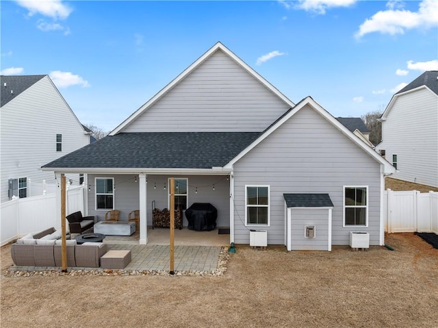 back of property with a patio and outdoor lounge area