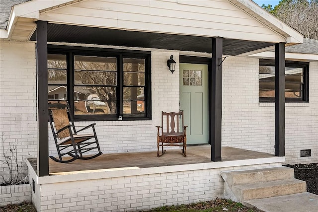 doorway to property with a porch