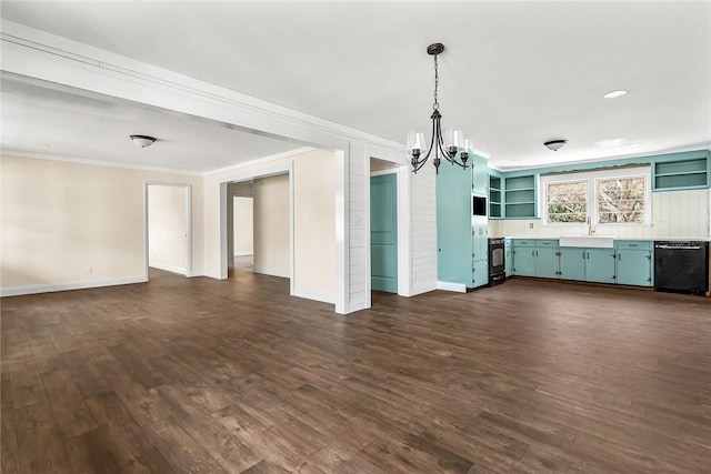 unfurnished living room with baseboards, ornamental molding, dark wood-type flooring, a chandelier, and a sink