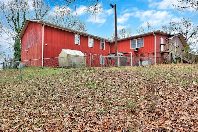 back of property with an outdoor structure