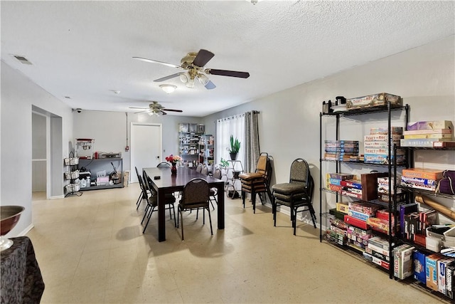 dining room featuring a textured ceiling