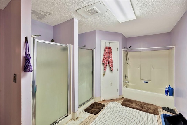 bathroom with tile patterned floors, an enclosed shower, and a textured ceiling