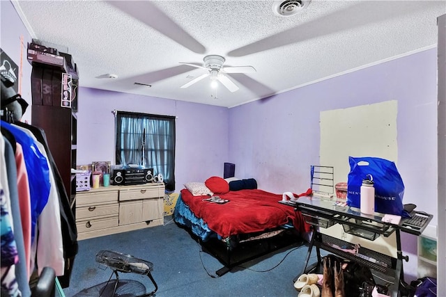 carpeted bedroom with ceiling fan, crown molding, and a textured ceiling